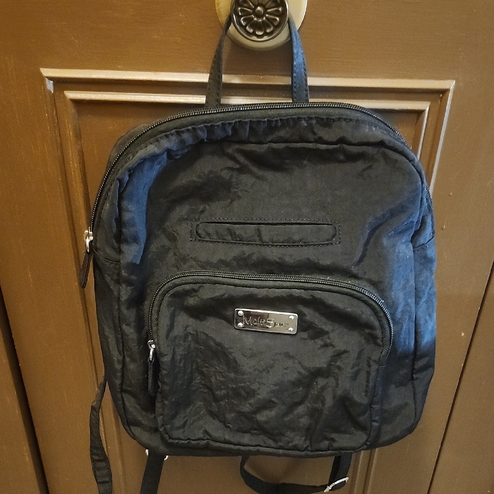 Black Backpack with Durable Design and Multiple Compartments